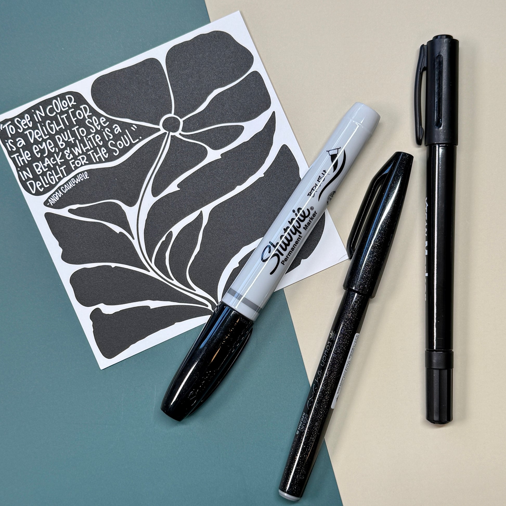 Lettering guide bundle with brush pens and monoline pen on desk