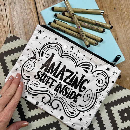 Flat lay of pens and dotted journal for journaling and hand lettering practice"