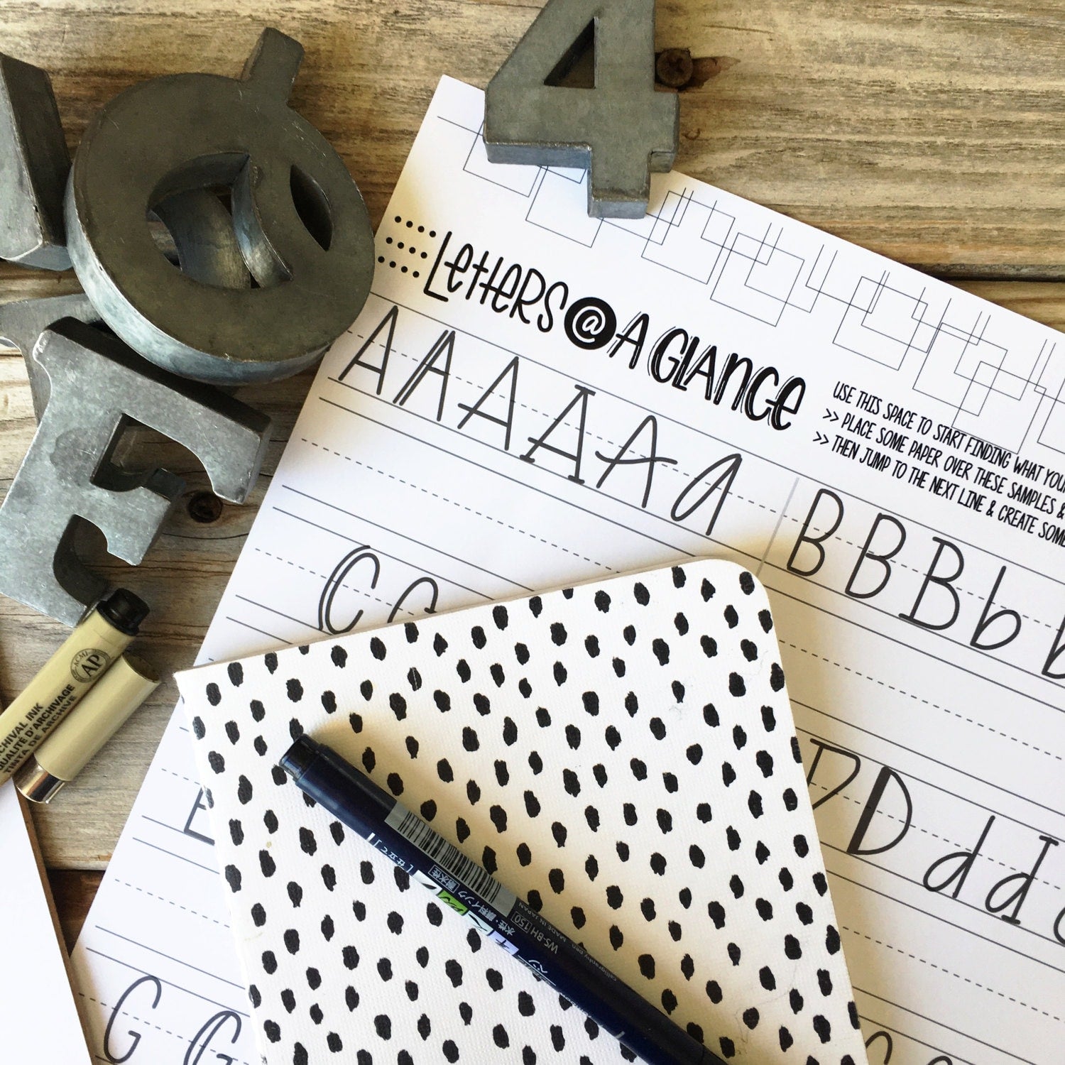 Practice sheets showing linear and brush lettering exercises on smooth premium paper"