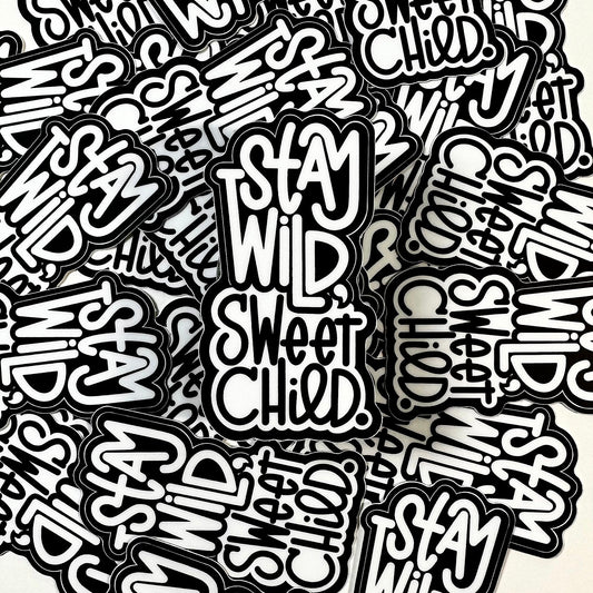 many black and white stickers laying together in a pile.