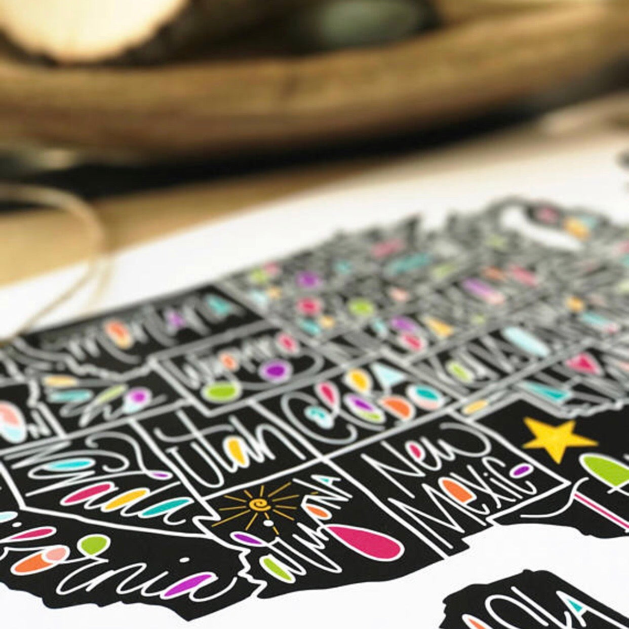 Hand using stylus to trace Linear Lettering style on a digital worksheet on tablet
