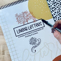 Hand lettering workbook showing traceable linear letter styles