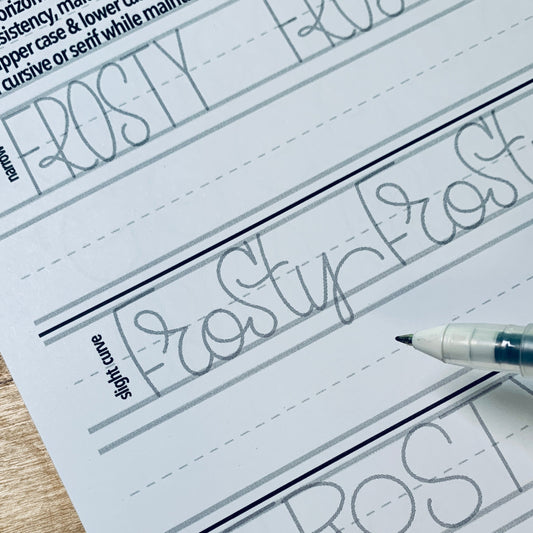 Top-bound lettering guide open to a practice page