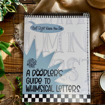 Cover of The Doodler’s Guide to Whimsical Letters paper workbook for hand lettering beginners