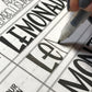 Printed Wonky Letters worksheet with pen and tracing paper for at-home creative practice