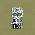 A vinyl decal sticker with an illustration of a moth and the phrase 'WILD AND FREE'.
