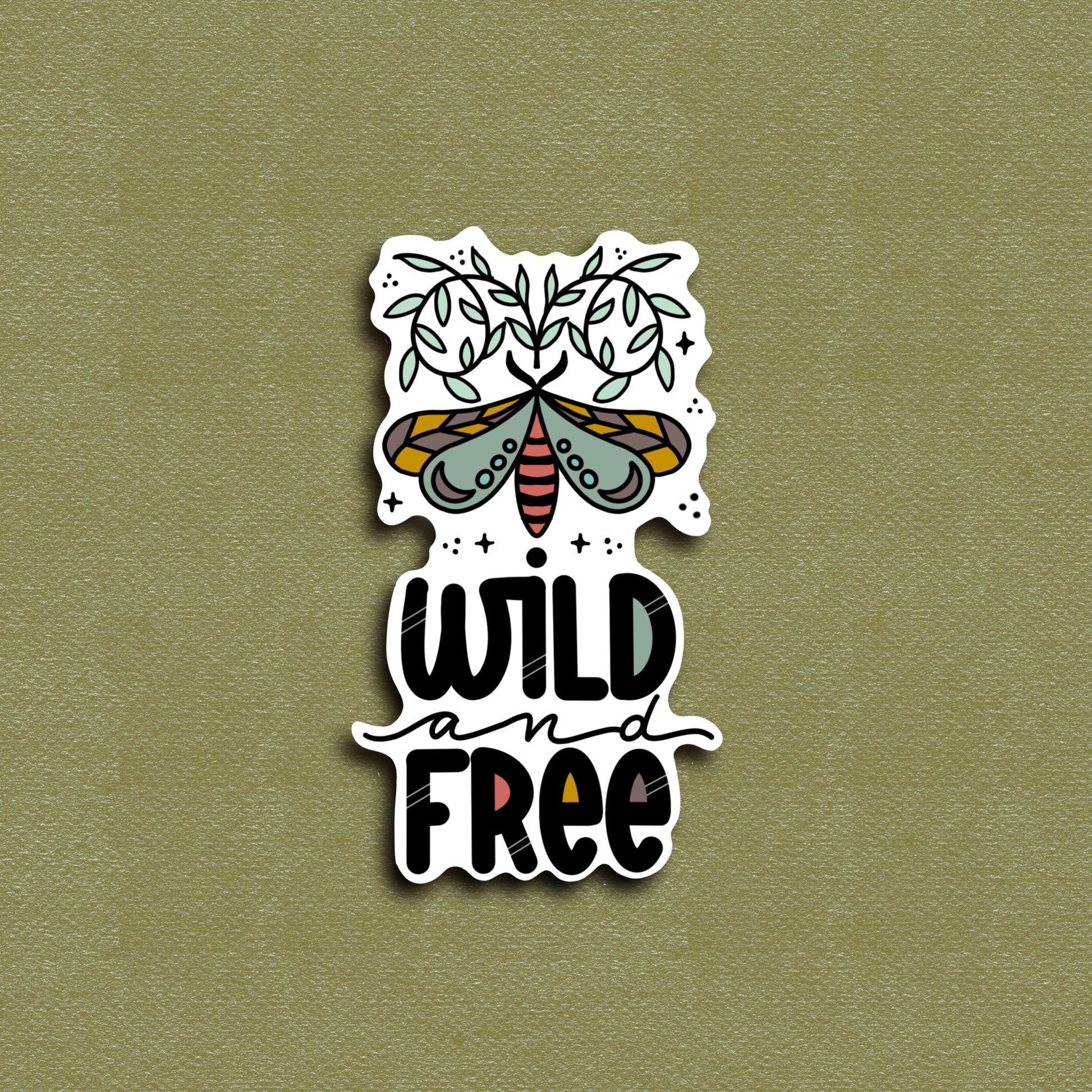 A vinyl decal sticker with an illustration of a moth and the phrase 'WILD AND FREE'.